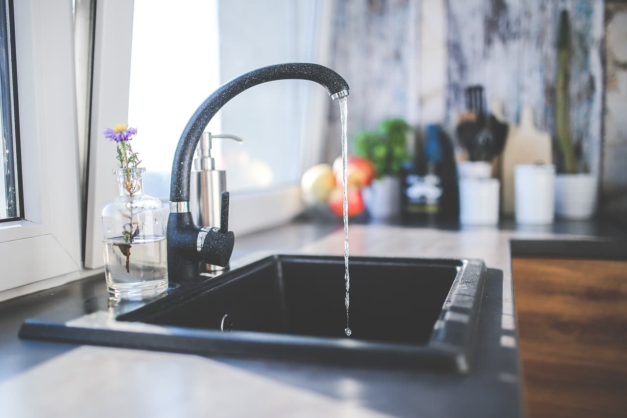 Kitchen sink with the tap running
